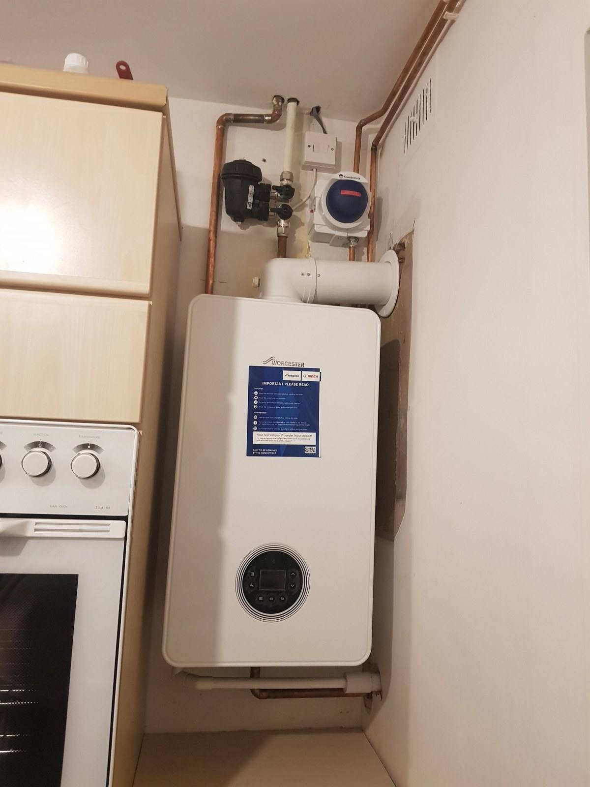 New Worcester Bosch boiler with system filter, fitted in a kitchen in Reading
