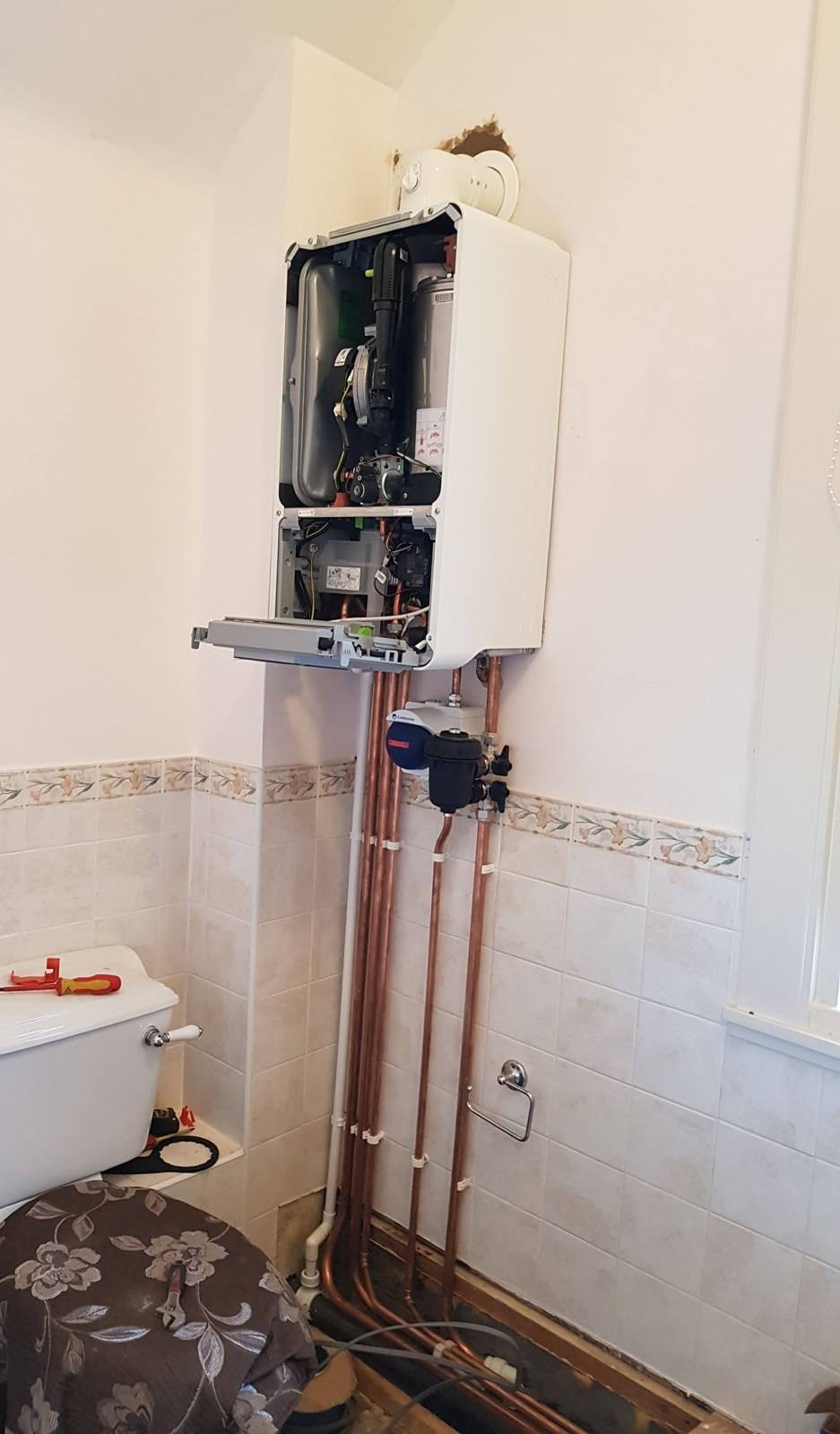 New boiler being commissioned, with copper pipework and a system filter, in Tilehurst