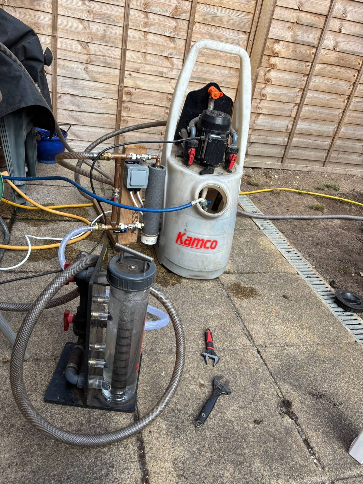 Power flushing equipment connected to a central heating system in Reading
